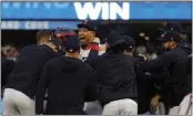  ?? BRUCE KLUCKHOHN — THE ASSOCIATED PRESS ?? Minnesota pitcher Jhoan Duran, middle, celebrates with teammates after the Twins eliminated Toronto.