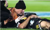  ?? PHOTO: GETTY IMAGES ?? Jack Debreczeni lies injured duringlast night’s match.