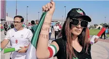  ?? | Reuters ?? A WOMAN holds up her arm showing an inscriptio­n reading ‘Woman, life, freedom’ before a match at the Ahmad Bin Ali Stadium during the FIFA World Cup in Qatar.