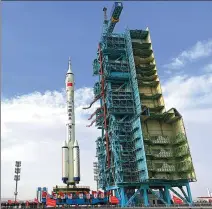  ?? WANG JIANGBO / FOR CHINA DAILY ?? China’s Shenzhou XV manned spacecraft and a Long March 2F carrier rocket are transferre­d to the Jiuquan Satellite Launch Center in the Gobi Desert on Monday. Final checks will be conducted ahead of the launch, which is expected in coming weeks.