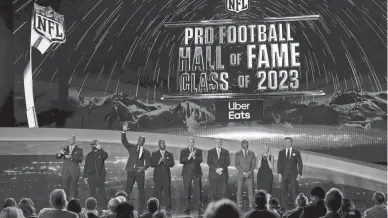  ?? DAVID J. PHILLIP/AP ?? The Pro Football Hall of Fame Class of 2023 poses on stage during the NFL Honors awards show on Thursday in Phoenix.