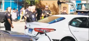  ?? David Michel / Contribute­d photo ?? Officers respond to a car chase in downtown Stamford that ended in the arrest of Marcus Brian Moore, a “high-level” drug dealer, police said.