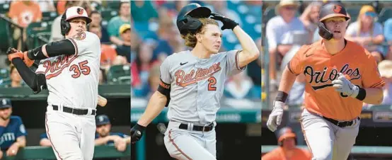  ?? BALTIMORE SUN PHOTOS BY KEVIN RICHARDSON/BALTIMORE SUN, RON SCHWANE/AP AND KARL MERTON FERRON/ ?? With Adley Rutschman, left, Gunnar Henderson, center, and Kyle Stowers, right, part of a playoff push, 2019 is the first draft the Orioles’ first three picks have reached Baltimore since 2008, and the trio starting together as part of Saturday’s lineup against Oakland marked a franchise first.