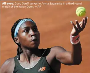  ??  ?? All eyes: Coco Gauff serves to aryna Sabalenka in a third round match of the Italian Open. — aP