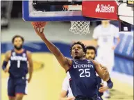  ?? John Peterson / Associated Press ?? UConn forward Josh Carlton drives to the basket for a layup against Creighton on Jan. 23.