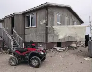  ?? THE CANADIAN PRESS / FILES ?? A polar bear hide dries outside a house in Nunavut. The federal government is expected make a long-term commitment to Indigenous housing in next week’s budget.