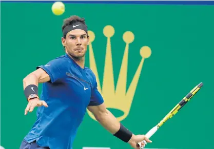  ??  ?? Rafael Nadal hits a forehand return during his quarter-final match against Grigor Dimitrov.