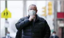  ?? ASSOCIATED PRESS ?? Philadelph­ia Mayor Jim Kenney walks to view a COVID-19 vaccinatio­n clinic at the Grand Yesha Ballroom in Philadelph­ia, Wednesday, March 17, 2021.