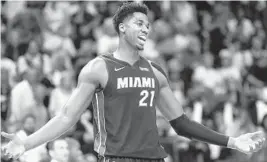  ?? LYNNE SLADKY/AP ?? Hassan Whiteside (above), Bam Adebayo and Kelly Olynyk are finding that three can be a crowd when it comes to the Miami Heat’s rotation at center.