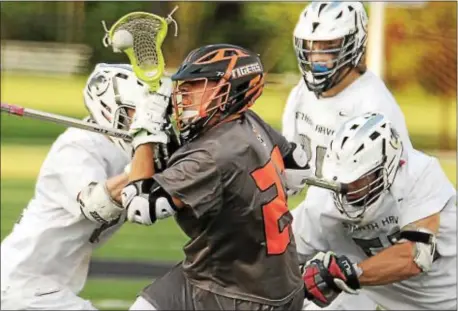  ?? DIGITAL FIRST MEDIA FILE ?? Marple Newtown’s Alex Funk, center, seen here surrounded by Strath Haven players in the scored three goals as the Tigers took down nonleague foe Archbishop Carroll Saturday. District 1 playoffs last spring,