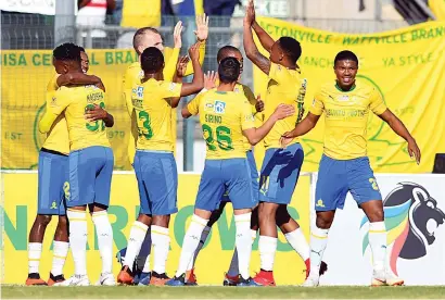  ?? Picture: Gallo Images ?? HAPPY BAND. Mamelodi Sundowns players celebrate in front of their fans after Sibusiso Vilakazi scored during the MTN8 quarterfin­al against Golden Arrows at Lucas Moripe Stadium on Saturday.