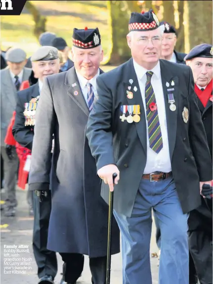  ??  ?? Family affair Bobby Russell, left, with grandson Noah McGarry at last year’s parade in East Kilbride