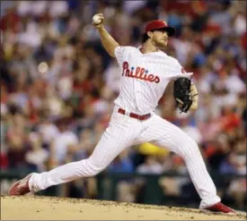  ?? MATT SLOCUM — THE ASSOCIATED PRESS ?? Philadelph­ia Phillies’ Aaron Nola pitches during the third inning of a baseball game against the New York Mets, Saturday.