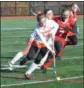  ?? THOMAS NASH - DIGITAL FIRST MEDIA ?? Perkiomen Valley’s Lauren Foley, left, picks up the ball while Wilson’s Morgan Kauffman defends.