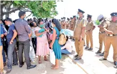  ??  ?? Students gathered outside the Presidenti­al Secretaria­t on Tuesday. Pic by Amila Gamage