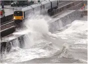  ??  ?? In the foreground we can see a clapotic wave, which has reflected off the wall of Dawlish train station and collided with an incoming wave