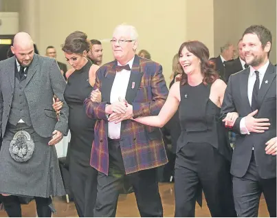  ?? Picture: Wullie Marr. ?? Jim Leishman, centre, and his family at the Margaret Leishman Foundation ball in Dunfermlin­e, which helped the foundation smash the £1 million barrier.