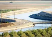  ?? AP PHOTO BY RUSSEL A. DANIELS ?? In this 2009 file photo, in California's Westland Water District of the Central Valley, canals carry water to southern California.