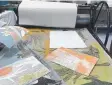  ??  ?? ALL SET: Background prints hot off the press.