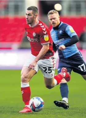  ??  ?? Bristol City’s Tommy Rowe is chased by Wycombe’s Daryl Horgan