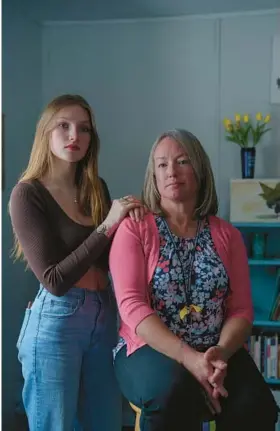  ?? JOHN TULLY/THE NEW YORK TIMES ?? Camryn Baron, left, seen Jan. 29, founded the Yellow Tulip Team at her high school in Hiram, Maine, with the help of faculty adviser Elizabeth Sanborn.