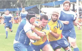  ?? (David Silverman/Courtesy) ?? RUGBY HAS been a niche sport in Israel for a long time but is hoping to garner more mainstream appeal. Above, the National Team (in blue) tackles Andorra in a match.