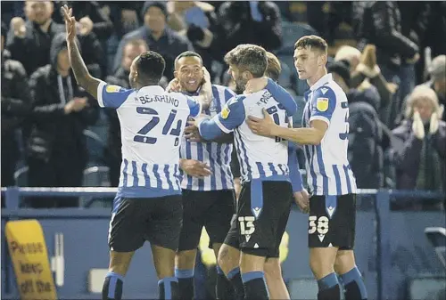  ?? PICTURE: STEVE ELLIS ?? OWLS JOY:
Sheffield Wednesday players celebrate Nathaniel Mendez-Laing’s goal to secure a 2-0 win at Hillsborou­gh last night.