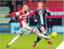  ??  ?? ■ Accies’ Georgios Sarris tackles Liam Boyce.