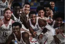  ?? COURTESY FIBA ?? Duke-bound R.J. Barrett, centre, and the Canadian men’s under-19 basketball team made history by winning world gold in Cairo in July.