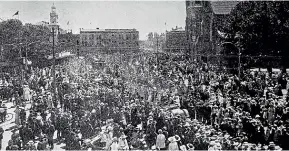  ??  ?? Armistice Day celebratio­ns went ahead in Christchur­ch’s Cathedral Square despite fears of the flu pandemic.