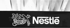  ??  ?? The Nestle logo is pictured on the company’s headquarte­rs. — Reuters photo