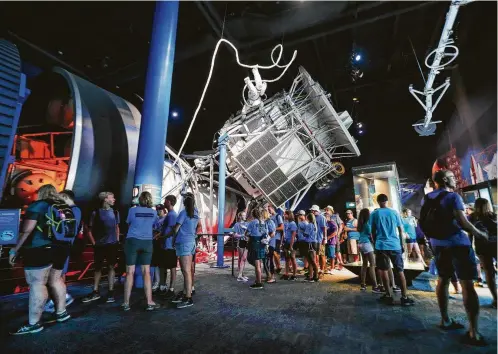  ?? Steve Gonzales photos / Houston Chronicle ?? Visitors wait to enter the Skylab 1-G Trainer at Space Center Houston.