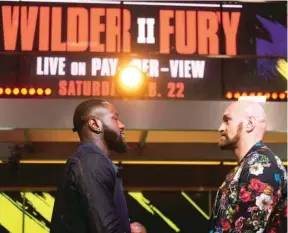  ?? (AFP) ?? In this January 25, 2020, picture, boxers Deontay Wilder (left) and Tyson Fury face off during a press conference in Los Angeles, United States.