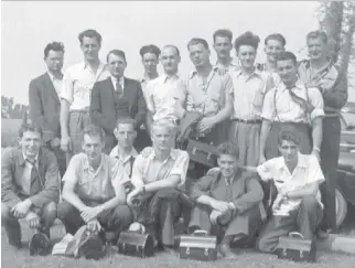  ??  ?? Initially with a staff of 20 radio operators and other personnel, Ottawa’s hush-hush intercept station grew to a full staff of 125 men and women in the final years of Second World War. Ernie Brown, seen here with colleagues, is fifth from the right at...