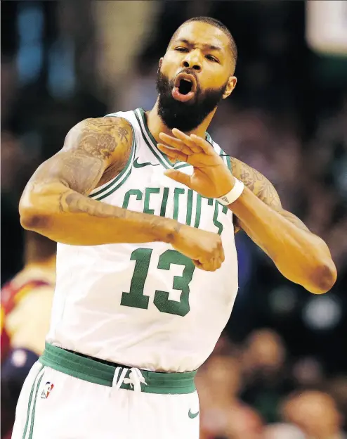  ?? GETTY IMAGES ?? Boston’s Marcus Morris celebrates after hitting a basket against the visiting Cavaliers during the first quarter on Sunday at TD Garden. The Celtics scorched the Cavs 108-83.