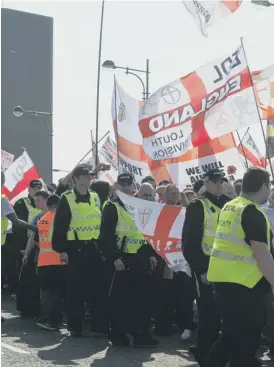  ??  ?? Officers escort the EDL demonstrat­ion