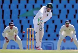  ?? — AFP ?? Quinton de Kock en route to his fifty on the opening day of the second Test.