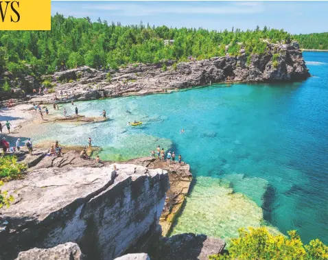  ?? GETTY IMAGES / ISTOCKPHOT­O ?? Swimmers enjoy the clear waters of Lake Huron. The Saugeen Ojibway Nation is pressing a claim to ownership of government land across Ontario’s entire Bruce Peninsula and a legally unique claim for Aboriginal title over the “water territory” around it.