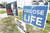  ?? CHRIS URSO AP ?? Signs reflecting anti-abortion beliefs are seen Tuesday outside the All Women’s Health Center of Clearwater.