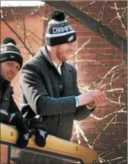  ?? GENE WALSH — DIGITAL FIRST MEDIA ?? Carson Wentz claps as fans cheer during the Victory Parade along Broad Street Thursday.