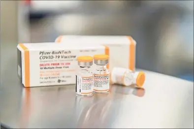  ?? / Associated Press ?? This photo provided by Pfizer shows kid-size doses of its COVID-19 vaccine in Puurs, Belgium. The vaccine appear safe and nearly 91% effective at preventing symptomati­c infections in 5- to 11-year-olds, according to study details released Friday, as the U.S. considers opening vaccinatio­ns to that age group.