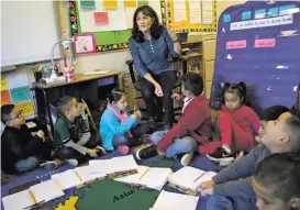  ??  ?? Rita RiosBaca on Nov. 19 discusses wind with her firstgrade students after using bubbles to demonstrat­e basic principles of wind and weather.