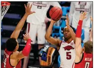  ?? (AP Photo/Darron Cummings) ?? Patience under pressure will be necessary for success today against Baylor for guard Moses Moody (5) and the Razorbacks, Arkansas Coach Eric Musselman said.