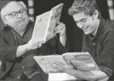  ?? ASSOCIATED PRESS ?? IN THIS MARCH. 2, 2012, FILE PHOTO, stars Danny DeVito (left) and Zac Efron read “The Lorax” by Dr. Seuss to school children during the annual Read Across America Day at The New York Public Library in New York.