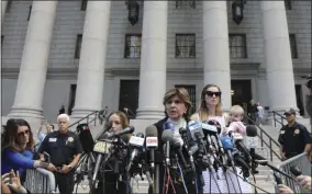  ?? BEBETO MATTHEWS — THE ASSOCIATED PRESS ?? Attorney Gloria Allred, center, flanked by two of her clients, speak during a news conference after leaving a Manhattan court where sexual victims, on invitation of a judge, addressed a hearing after the accused Jeffrey Epstein killed himself before facing sex traffickin­g charges, Tuesday in New York.