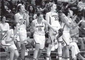  ??  ?? From left, UConn’s Kia Nurse, Napheesa Collier, Gabby Williams, Katie Lou Samuelson and Saniya Chong react to second-half action during the Huskies’ rout of Albany. Jessica Hill, The Associated Press