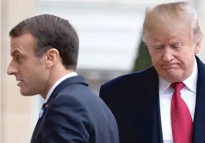  ?? SAUL LOEB/AFP/GETTY IMAGES ?? President Donald Trump with French President Emmanuel Macron in Paris last Saturday.