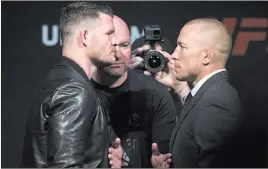  ?? Erik Verduzco ?? Las Vegas Review-journal @Erik_verduzco Michael Bisping, left, and George St. Pierre go chin to chin during a UFC news conference on March 3 at T-mobile Arena for their future middleweig­ht fight.