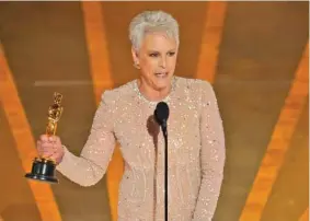  ?? AP PHOTO/CHRIS PIZZELLO ?? Jamie Lee Curtis accepts the award for best performanc­e by an actress in a supporting role for “Everything Everywhere All at Once” on Sunday at the Oscars at the Dolby Theatre in Los Angeles.