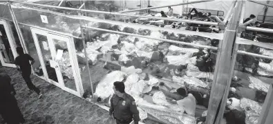  ?? DARIO LOPEZ-MILLS/AP ?? Minors rest inside a pod at the Donna Department of Homeland Security holding facility March 30 in Donna, Texas. More Americans disapprove of how President Joe Biden’s administra­tion is handling the waves of immigratio­n.